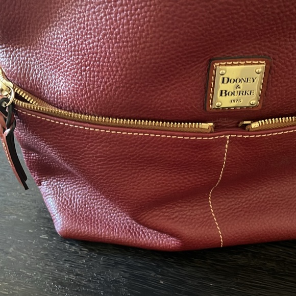Dooney & Bourke shoulder purse. Burgundy colored. Like new. - Picture 6 of 6